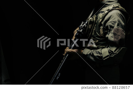 Soldier holding a gun 88128657