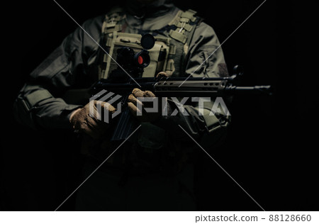 Soldier holding a gun 88128660