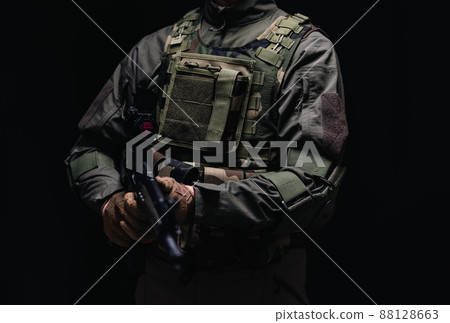 Soldier holding a gun 88128663