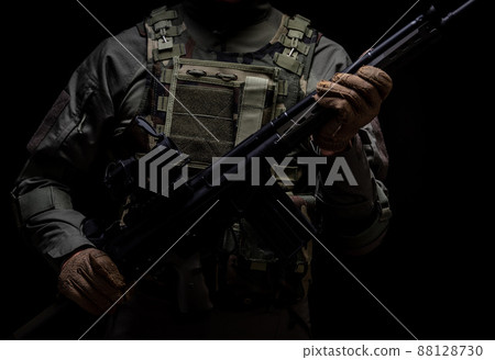 Soldier holding a gun 88128730