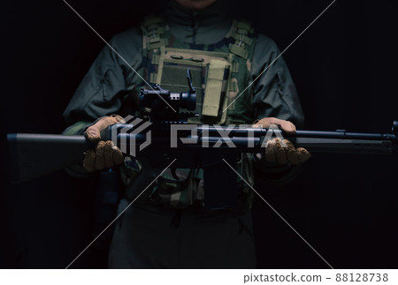 Soldier holding a gun 88128738