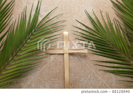 Palm cross and palm leaves. Palm sunday and easter day concept. 88128840