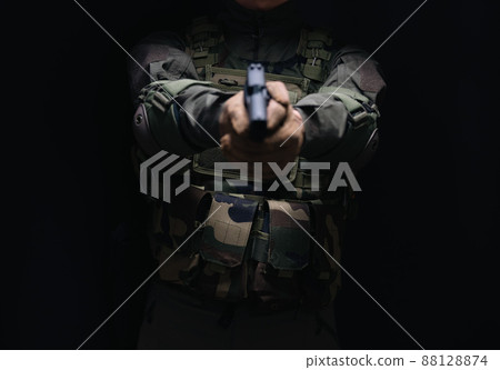 Soldier holding a pistol 88128874