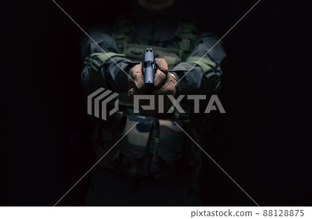 Soldier holding a pistol 88128875