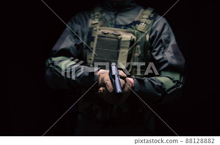 Soldier holding a pistol 88128882