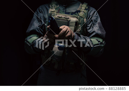 Soldier holding a pistol Soldier holding a pistol 88128885