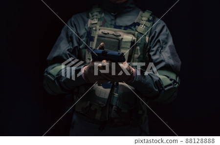 Soldier holding a pistol 88128888