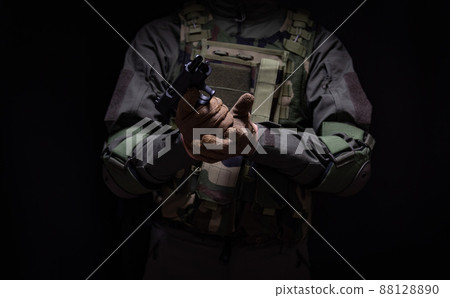 Soldier holding a pistol 88128890