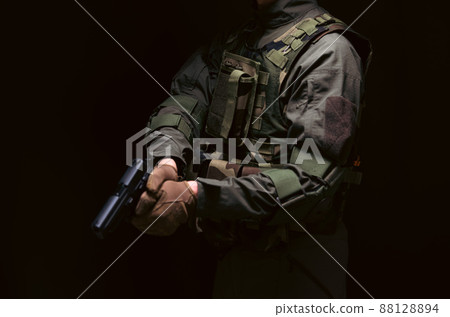 Soldier holding a pistol 88128894