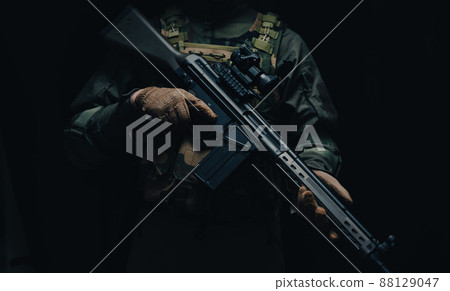 Soldier holding a gun 88129047