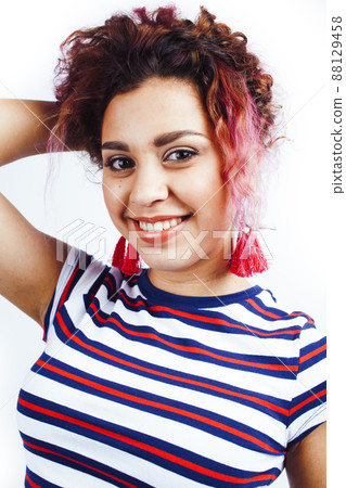 young happy smiling latin american teenage girl emotional posing on white background, lifestyle people concept 88129458