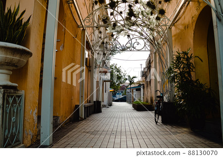 Vintage colonial style building facade in an alleyway of the heritage town of Penang, Malaysia 88130070