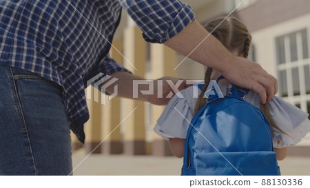 little child with backpack dad goes school. happy family. child dream education concept. kid girl daughter with school bag her shoulders goes study. healthy child background school yard. time study. little child with backpack dad goes school. happy family. child dream education concept. kid girl daughter with school bag her shoulders goes study. healthy child background school yard. time study. 88130336