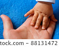 Hand of a child on a woman's palm 88131472