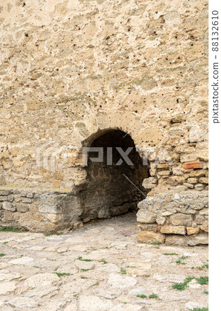 An ancient fortress on the shore of the bay. Majestic stone walls, beautiful arched vaults, loophole windows. Ukraine. Belgorod - Dnestrovsky. An ancient fortress on the shore of the bay. Majestic stone walls, beautiful arched vaults, loophole windows. Ukraine. Belgorod - Dnestrovsky. 88132610