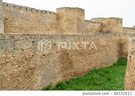 An ancient fortress on the shore of the bay. Majestic stone walls, beautiful arched vaults, loophole windows. Ukraine. Belgorod - Dnestrovsky. An ancient fortress on the shore of the bay. Majestic stone walls, beautiful arched vaults, loophole windows. Ukraine. Belgorod - Dnestrovsky. 88132611