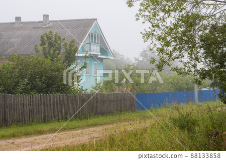 View of a beautiful wooden house in the village 88133858