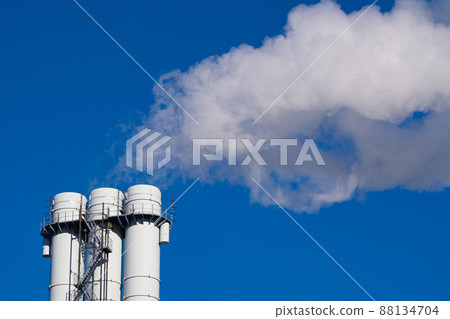 Air pollution by smoke coming out of pipes against blue sky. Concept of pollution, environmental problems and emissions Air pollution by smoke coming out of pipes against blue sky. Concept of pollution, environmental problems and emissions 88134704