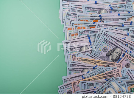 American dollars on a green background. Finance and business. American dollars on a green background. Finance and business. 88134758