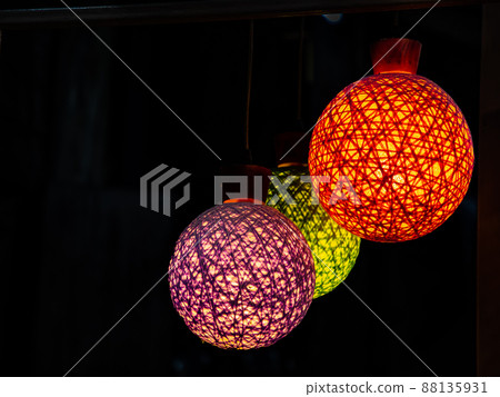 lamp in the form of a ball against the background of colorblack 88135931
