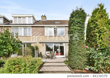 Mind-blowing courtyard of the house with comfortable chairs and greenery Mind-blowing courtyard of the house with comfortable chairs and greenery 88138370