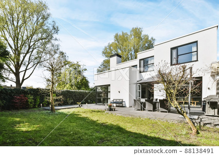 The courtyard of the house in a minimalist style with a lawn The courtyard of the house in a minimalist style with a lawn 88138491