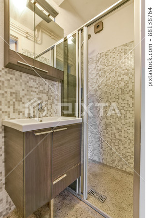 Interior of contemporary bathroom with shower and sink in minimal style in flat Interior of contemporary bathroom with shower and sink in minimal style in flat 88138764