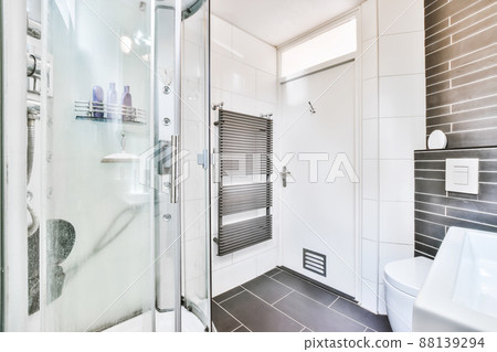 Magnificent bathroom with shower and black floor Magnificent bathroom with shower and black floor 88139294