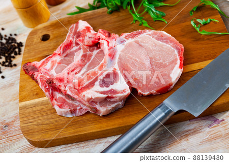 Fresh raw pork loin chops with condiments Fresh raw pork loin chops with condiments 88139480