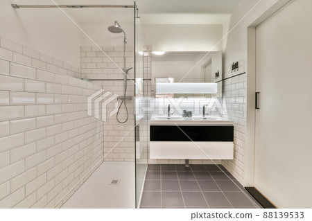 Modern bathroom with shower and double sink in a new house Modern bathroom with shower and double sink in a new house 88139533