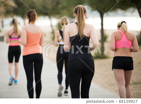 Smiling young women during racewalking training 88139927