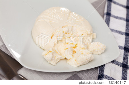 Brined curd white cheese on plate Brined curd white cheese on plate 88140147