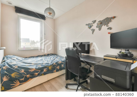 Compact bedroom with single bed and work area at home 88140360
