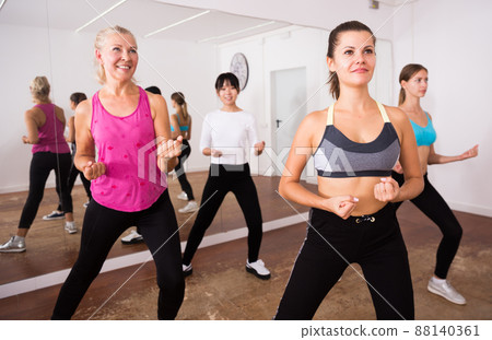 Fitness women practicing zumba movements Fitness women practicing zumba movements 88140361