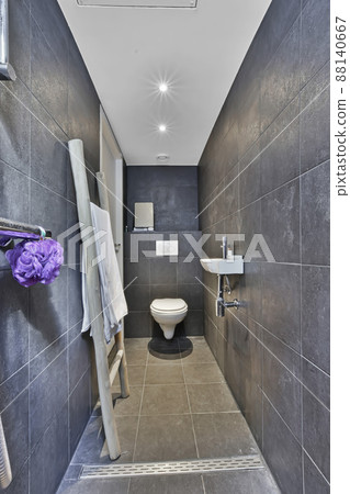 Interior of small clean restroom in miniature style 88140667