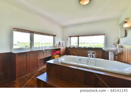 Spacious bathroom with bathtub and towel, wooden walls in the bathroom 88141145