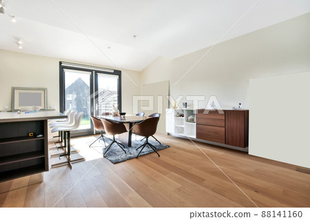 Spacious and practical dining areas with wooden steel and leather chairs 88141160
