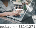 Personal Data Access and Technology Security for Business Financial. Business Woman Using Mobile While Accessing Private Data on Laptop. Technology Database Security Network System for Global Business 88141271