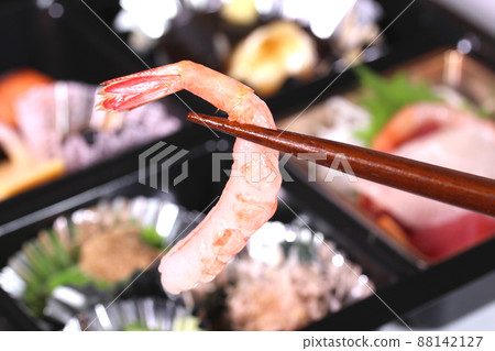 Shokado bento: Eating shrimp sashimi Shokado bento: Eating shrimp sashimi 88142127