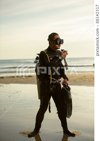 diver rescue in wetsuit  equipment for scuba diving.  88142317