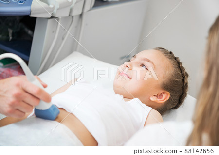 Medical procedure of smiling little girl Medical procedure of smiling little girl 88142656