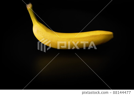 Yellow banana on a black background. Healthy food Yellow banana on a black background. Healthy food 88144477