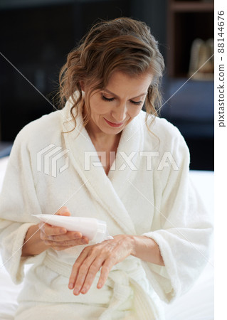 Mature Woman Applying Hand Cream 88144676