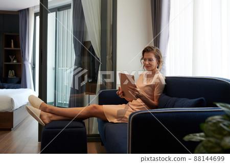 Female Entrepreneur Reading Articles on Tablet 88144699