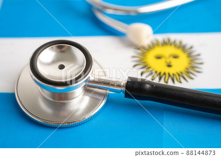 Black stethoscope on Argentina flag background, Business and finance concept. Black stethoscope on Argentina flag background, Business and finance concept. 88144873
