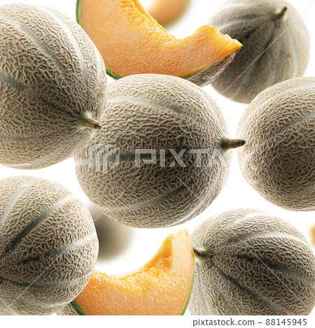 Whole and slices of melon levitate on a white background 88145945