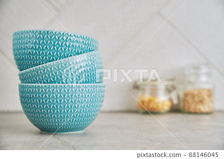 Three bowls on kitchen table 88146045