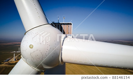 Aerial view of part of windmill turbine in countryside, Green energy 88146154