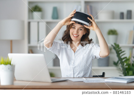 Woman with VR virtual reality goggles 88146183