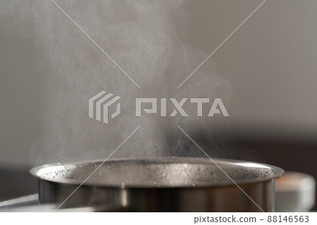 Saicepan with hot boiling water closeup 88146563
